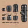A disassembled portable espresso maker with labels pointing to each part. Produktbild-Vorschau