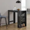 A black bar table with shelves is shown in a room with a gray wall and wooden floor. A stool is placed next to the table. Náhled obrázku produktu
