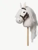 A white hobby horse with a brown bridle and a wooden stick, set against a plain white background. Podgląd zdjęcia produktu