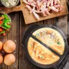 A top-down view of cooking ingredients and an omelette maker. Produktbild-Vorschau