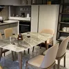 A dining table with chairs in a modern kitchen setting. Produktbild-Vorschau