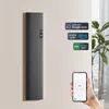 A hand holding a smartphone displaying a temperature control app, with a sleek, modern electric heater mounted on a wall in the background. Several compatibility logos are also visible on the wall. Anteprima dell’immagine prodotto