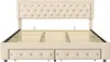 A beige upholstered bed frame with a tufted headboard and built-in drawers is shown from the front. Produktbild-Vorschau