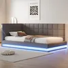 A modern grey upholstered bed with blue LED lighting. Produktbild-Vorschau