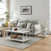 A modern living room scene featuring a sectional sofa, coffee table, and side table. Produktbild-Vorschau