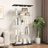 A glass display cabinet with books and decorative items on shelves, placed in a living room setting. Produktbild-Vorschau