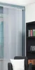 A room with a window covered by sliding panels, a bookshelf, and a chair with a pillow. Produktbild-Vorschau