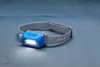A Philips LED rechargeable headlamp is shown on a textured gray surface. Náhled obrázku produktu