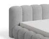 Close-up of a grey upholstered bed frame with a white mattress. Produktbild-Vorschau