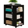 A black multifunctional printer stand with shelves and wheels, filled with office supplies and books. Náhled obrázku produktu
