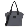 A studio shot of a gray baby stroller bag with black straps and a black logo. Produktbild-Vorschau