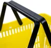 A close-up shot of the handle and upper rim of a yellow shopping basket. Náhled obrázku produktu