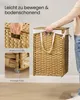 A person is holding a woven laundry basket with a lid and handles. Inset images show close-ups of the handles and the feet of the basket. Produktbild-Vorschau