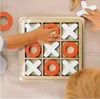 Children playing a wooden tic-tac-toe game. Náhled obrázku produktu