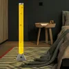 A bedroom scene with a floor lamp, bedside table, and bed. Produktbild-Vorschau