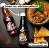 Two bottles of sauce are displayed next to a bowl of stew and toast, with text overlays. Produktbild-Vorschau