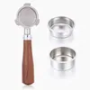 A coffee portafilter with a wooden handle and two filter baskets, displayed on a white background. Náhled obrázku produktu