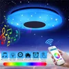 A ceiling light with music notes and a smartphone controlling it. Produktbild-Vorschau