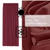 A close-up of a burgundy curtain fabric with icons and text indicating its features. Produktbild-Vorschau