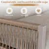 Close-up of a beige textile rope sofa with marketing text and icons highlighting its features. Produktbild-Vorschau