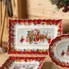 A festive Christmas scene featuring Villeroy & Boch plates with Santa and children. Produktbild-Vorschau