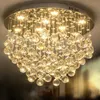A close-up view of a crystal chandelier with multiple light bulbs illuminating the crystals. Náhled obrázku produktu
