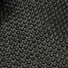 A close-up, abstract view of a black pool cover with a bubble-like texture. Podgląd zdjęcia produktu