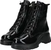 A pair of black patent leather lace-up boots with thick soles, shown from the front. Produktbild-Vorschau
