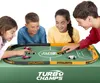 Four children are playing with a toy car racing game on a table. Náhľad obrázku produktu