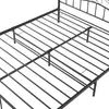 Close-up view of a black metal bed frame. Voir les images du produit