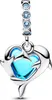 A silver charm in the shape of a heart with two dolphins embracing it, featuring a blue gem in the center. The charm hangs from a chain with small blue gems. Anteprima dell’immagine prodotto