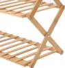 A close-up view of a two-tiered wooden shelf rack, made of bamboo, viewed from a diagonal angle. Produktbild-Vorschau