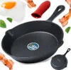 A collage of a cast iron frying pan with various food items and accessories. Voir les images du produit