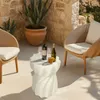 An outdoor patio setting with two chairs, a table, and drinks. Anteprima dell’immagine prodotto
