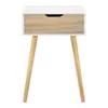 A white and wood bedside table with a drawer and three legs, presented on a white background. Náhled obrázku produktu
