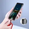 A hand holding a smartphone that is charging, with a close-up inset of a charger. Produktbild-Vorschau