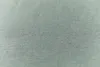 A close-up, textured view of a green fabric. Produktbild-Vorschau