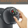 A close-up shot of a person's hand interacting with a coffee machine's control panel. Voir les images du produit