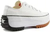 A side view of a white Converse Run Star Hike Ox sneaker with a thick white platform sole and a black and brown lug sole. Voir les images du produit