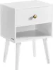 A white nightstand with a drawer and an open shelf, supported by wooden legs. Produktbild-Vorschau