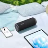 A portable speaker, smartphone, and tablet are arranged on a picnic blanket outdoors. Náhľad obrázku produktu