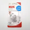 Product packaging for a NUK pacifier clip with a Disney Winnie the Pooh design. Produktbild-Vorschau