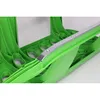 A close-up view of a green plastic sled with a silver metal reinforcement strip. Náhled obrázku produktu