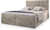A studio shot of a beige boxspring bed with a headboard and bedding. Produktbild-Vorschau