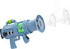 A blue toy gun with green liquid inside, emitting smoke rings. Náhled obrázku produktu