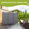 An outdoor patio with furniture and a three-panel screen divider. Produktbild-Vorschau