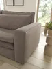A close-up view of a brown corduroy sofa armrest and part of the seat, with a window and greenery in the background. Produktbild-Vorschau
