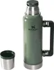 A green Stanley thermos bottle with a silver cup next to it, on a white background. Náhled obrázku produktu