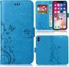 Collage of a blue flip phone case with a floral and butterfly design, showing the case open with cards and money, and closed from the back. Produktbild-Vorschau