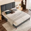 A bedroom scene with a bed, nightstand, and lamp. Náhled obrázku produktu